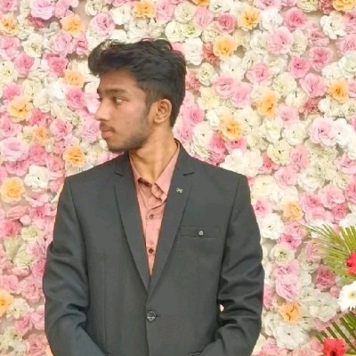 Joel Deva Deva Ezhile at a formal event